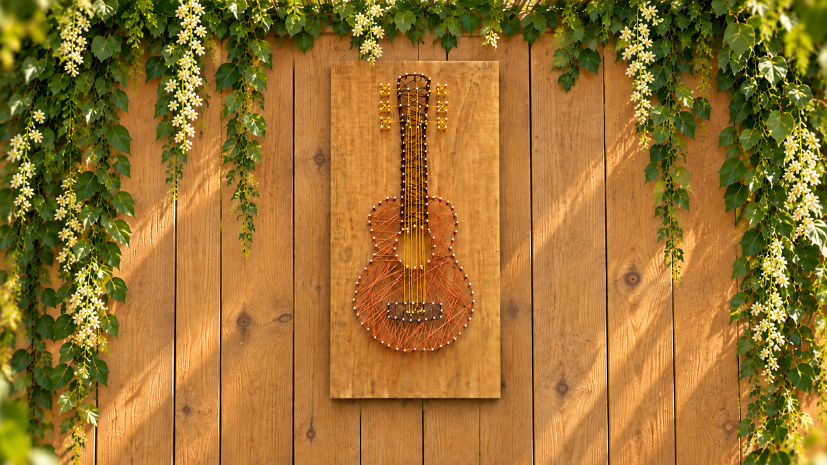 String art project with pine plywood guitar